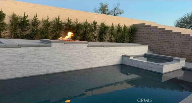 43118 Fiore St, Indio, CA 92203 - details with a jacuzzi and a swimming pool