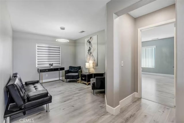 43118 Fiore St, Indio, CA 92203 - sitting room featuring baseboards, visible vents, and wood finished floors