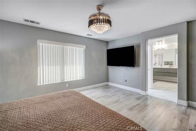 43118 Fiore St, Indio, CA 92203 - unfurnished bedroom with light wood-style flooring, baseboards, and visible vents