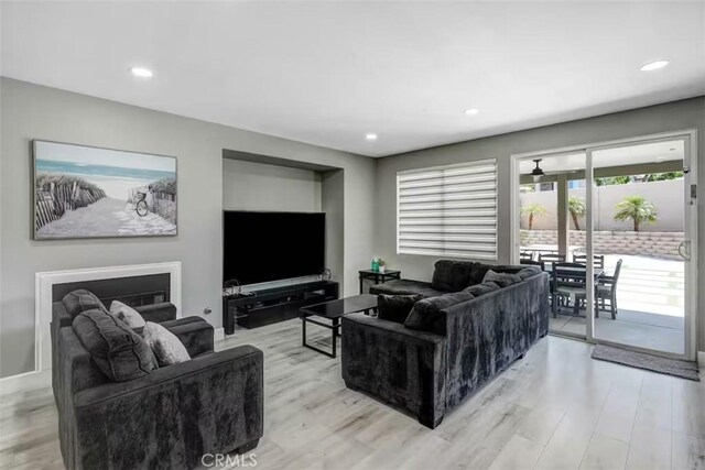 43118 Fiore St, Indio, CA 92203 - living room featuring light wood-style flooring and recessed lighting