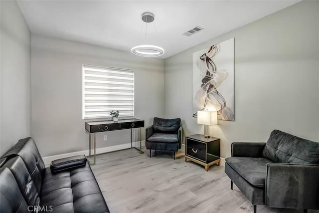 43118 Fiore St, Indio, CA 92203 - sitting room with baseboards, visible vents, and wood finished floors