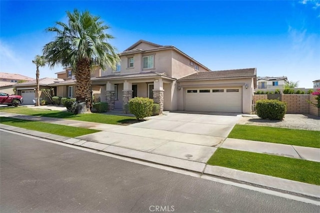 43118 Fiore St, Indio, CA 92203 - traditional-style home featuring concrete driveway, stucco siding, fence, and a garage