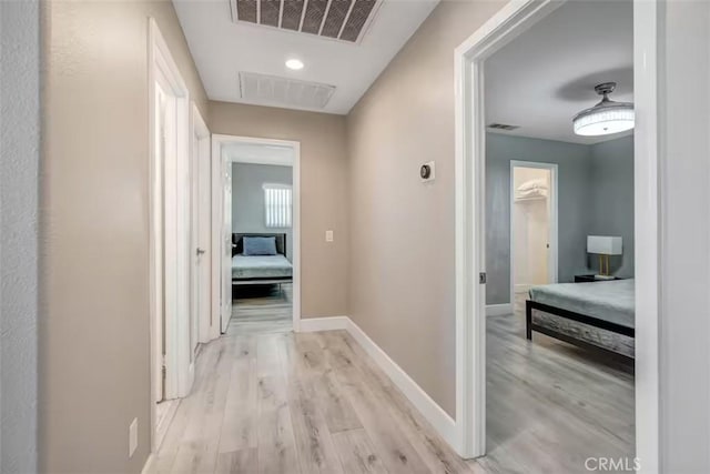43118 Fiore St, Indio, CA 92203 - hall featuring light wood-type flooring, visible vents, and baseboards