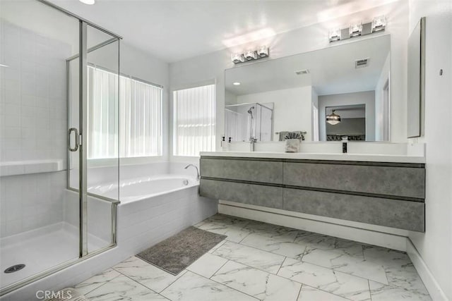 43118 Fiore St, Indio, CA 92203 - bathroom with a stall shower, marble finish floor, and a bath