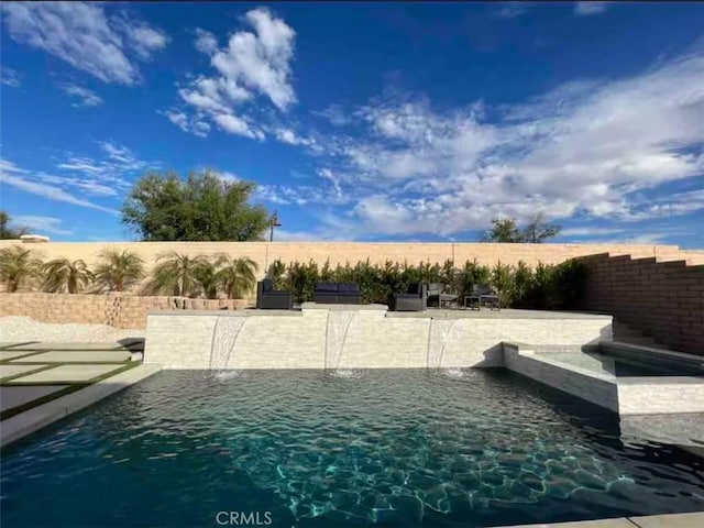 43118 Fiore St, Indio, CA 92203 - view of swimming pool with a fenced in pool and a fenced backyard