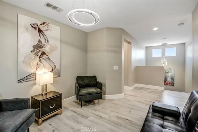 43118 Fiore St, Indio, CA 92203 - sitting room with recessed lighting, baseboards, visible vents, and wood finished floors