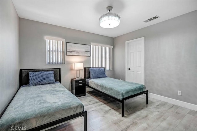 43118 Fiore St, Indio, CA 92203 - bedroom with light wood finished floors, visible vents, and baseboards