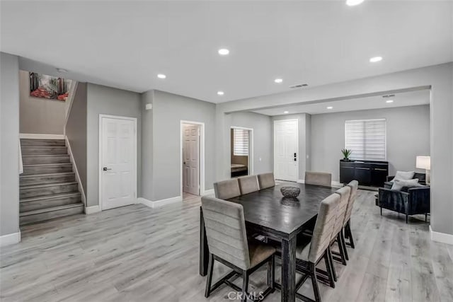 43118 Fiore St, Indio, CA 92203 - dining area featuring light wood-style flooring, stairs, a wealth of natural light, baseboards, and recessed lighting