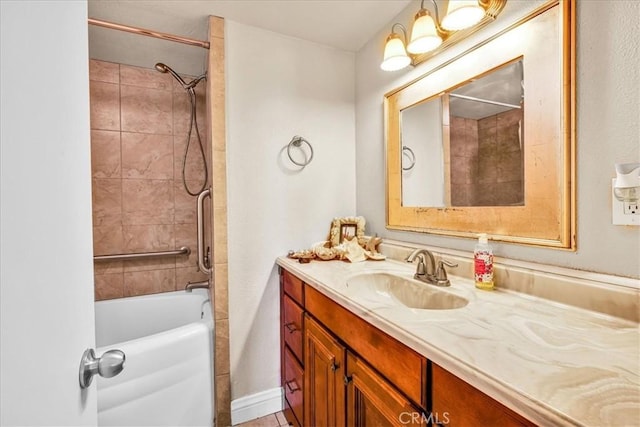 full bathroom with vanity, baseboards, and bathing tub / shower combination