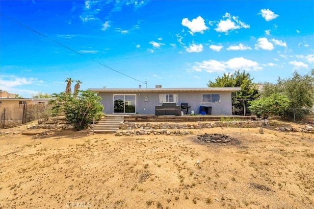 back of property with fence