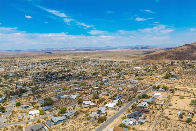 birds eye view of property with a mountain view and a residential view