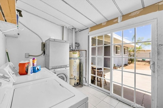 washroom with tile patterned flooring, separate washer and dryer, laundry area, and water heater
