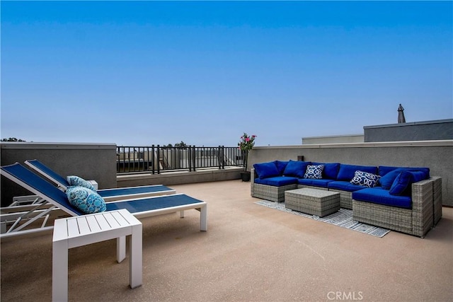 view of patio featuring outdoor lounge area and a balcony