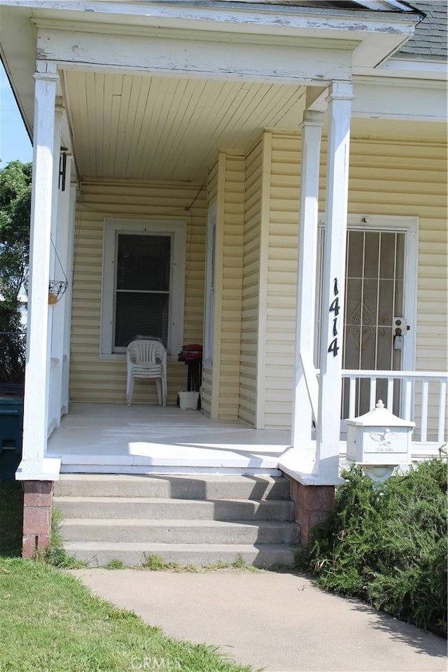 doorway to property featuring covered porch