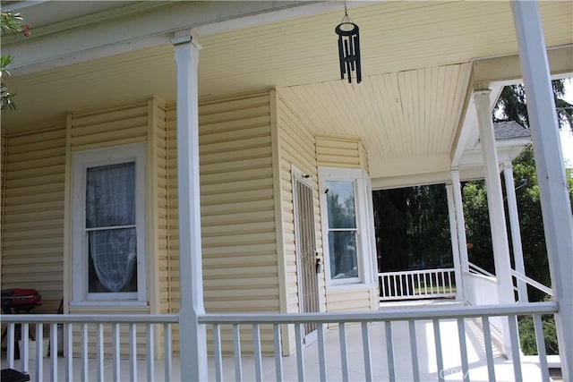 view of side of property with a porch