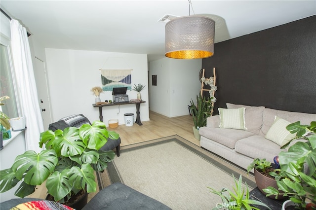 73881 Siesta Dr Unit 29, Palms, CA 92277 - living room featuring visible vents and wood finished floors