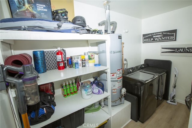 73881 Siesta Dr Unit 29, Palms, CA 92277 - storage room with washing machine and dryer and gas water heater