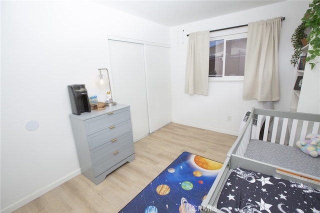 73881 Siesta Dr Unit 29, Palms, CA 92277 - bedroom featuring baseboards, a closet, and wood finished floors