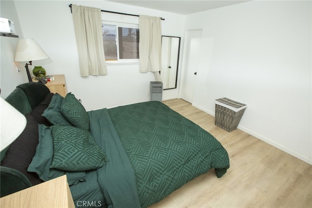 73881 Siesta Dr Unit 29, Palms, CA 92277 - bedroom featuring baseboards and wood finished floors