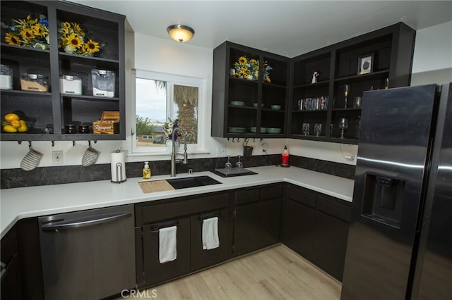 73881 Siesta Dr Unit 29, Palms, CA 92277 - kitchen featuring a sink, open shelves, fridge with ice dispenser, and dishwasher