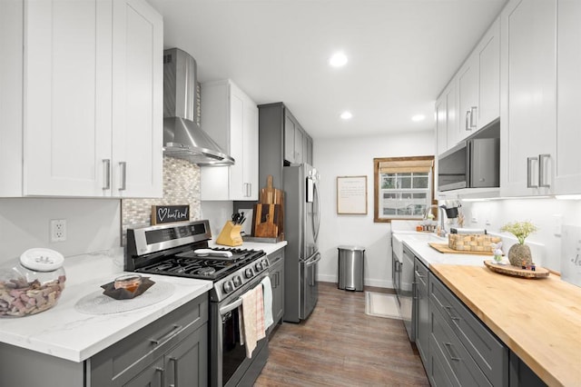 586 Del Mar Ave, Chula Vista, CA 91910 - kitchen with appliances with stainless steel finishes, wall chimney range hood, tasteful backsplash, gray cabinetry, and recessed lighting