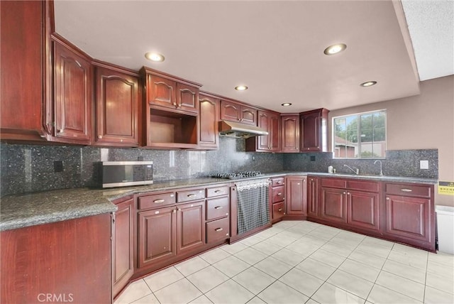 kitchen with light tile patterned floors, stainless steel appliances, recessed lighting, and under cabinet range hood