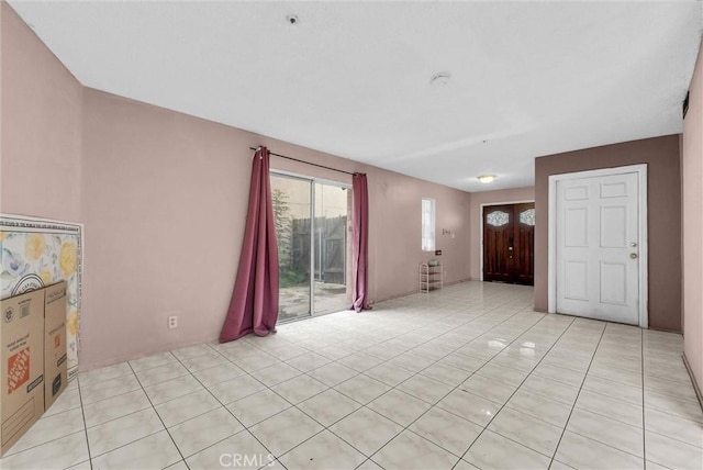 unfurnished living room with light tile patterned floors