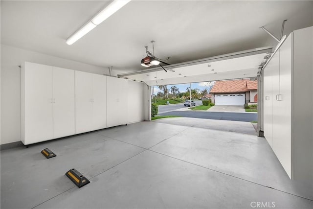garage featuring a garage door opener