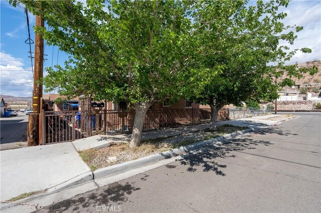 113 E White St, Barstow, CA 92311 - obstructed view of property with fence