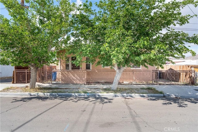 113 E White St, Barstow, CA 92311 - view of property hidden behind natural elements featuring a fenced front yard