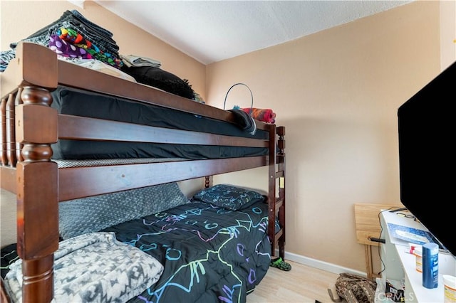 113 E White St, Barstow, CA 92311 - bedroom with wood finished floors and baseboards