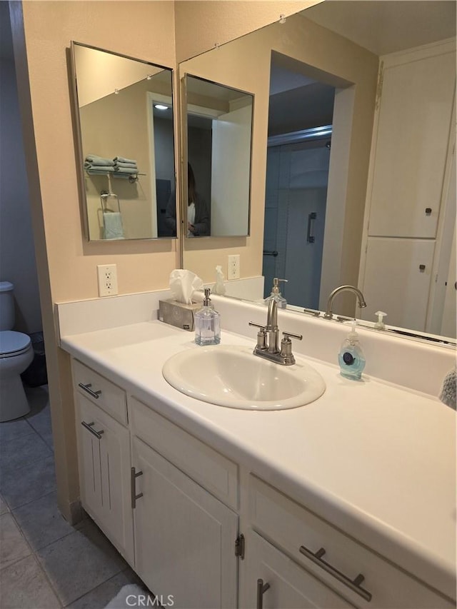 185 Avenida Majorca Unit A, Laguna Woods, CA 92637 - bathroom with toilet, vanity, and tile patterned floors