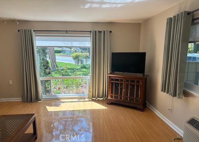 185 Avenida Majorca Unit A, Laguna Woods, CA 92637 - living room with wood finished floors and baseboards