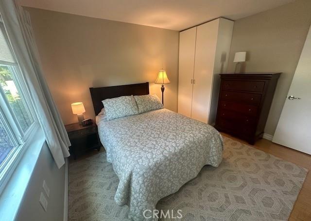 185 Avenida Majorca Unit A, Laguna Woods, CA 92637 - bedroom with light wood finished floors