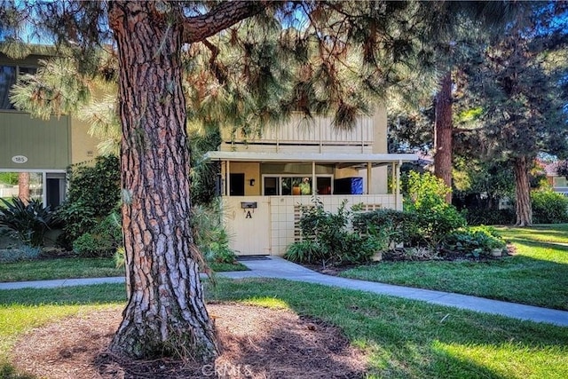 185 Avenida Majorca Unit A, Laguna Woods, CA 92637 - obstructed view of property with a front lawn