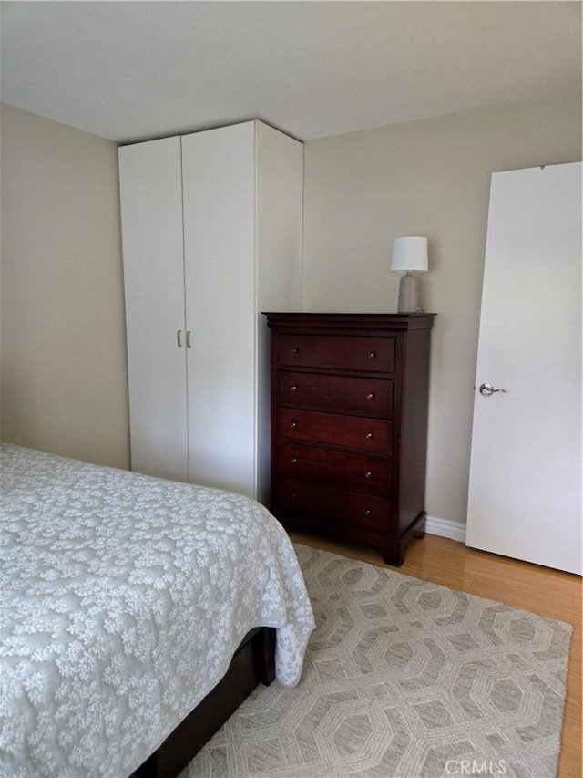185 Avenida Majorca Unit A, Laguna Woods, CA 92637 - bedroom featuring light wood finished floors and a closet