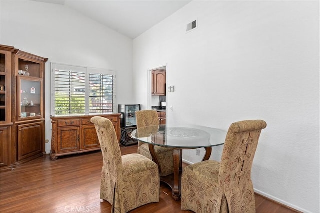 2757 Cape Dr, Corona, CA 92882 - dining room featuring dark wood-style flooring and high vaulted ceiling