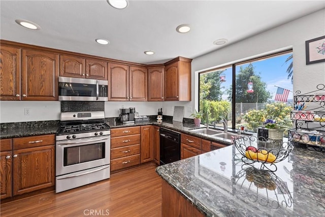 2757 Cape Dr, Corona, CA 92882 - kitchen with stainless steel appliances, wood finished floors, brown cabinets, and recessed lighting