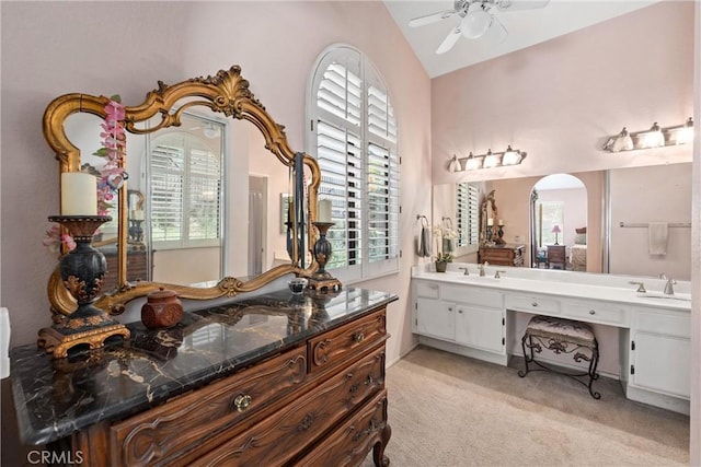 2757 Cape Dr, Corona, CA 92882 - bathroom with ceiling fan, double vanity, plenty of natural light, and vaulted ceiling