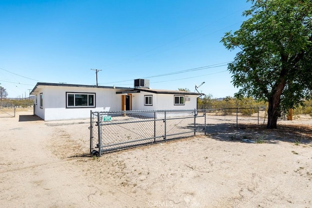 view of front of property featuring fence and a gate