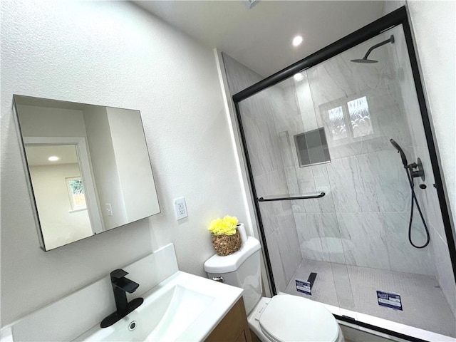 full bathroom with toilet, a shower stall, vanity, and recessed lighting