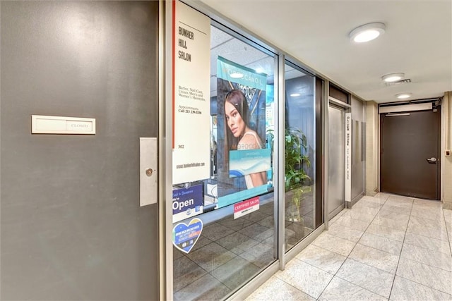 800 W 1st St Unit 710, Los Angeles, CA 90012 - hallway featuring light tile patterned floors and expansive windows
