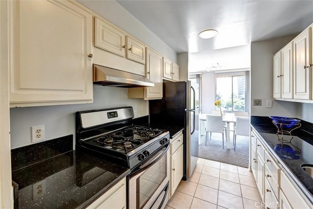 800 W 1st St Unit 710, Los Angeles, CA 90012 - kitchen with stainless steel gas stove, extractor fan, dark stone counters, and light carpet