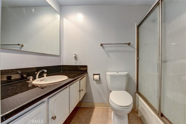 800 W 1st St Unit 710, Los Angeles, CA 90012 - bathroom with vanity, toilet, tile patterned flooring, shower / bath combination with glass door, and baseboards