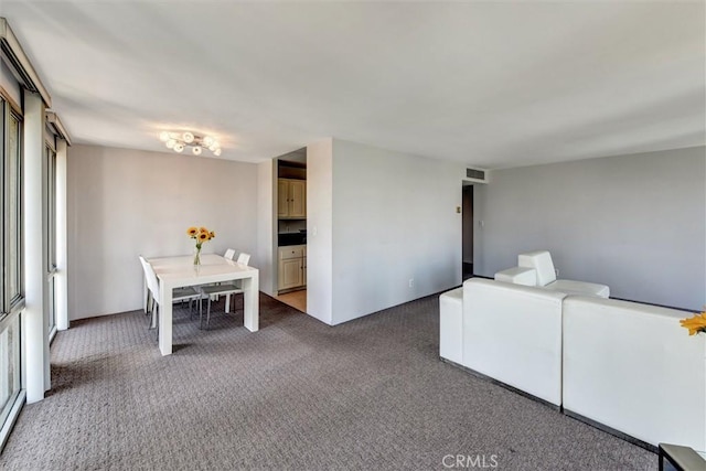800 W 1st St Unit 710, Los Angeles, CA 90012 - carpeted dining space with healthy amount of natural light