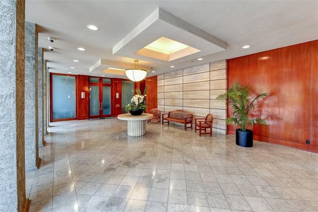 800 W 1st St Unit 710, Los Angeles, CA 90012 - building lobby featuring recessed lighting, a surveillance system, and wood walls