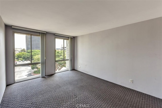800 W 1st St Unit 710, Los Angeles, CA 90012 - unfurnished room with carpet flooring