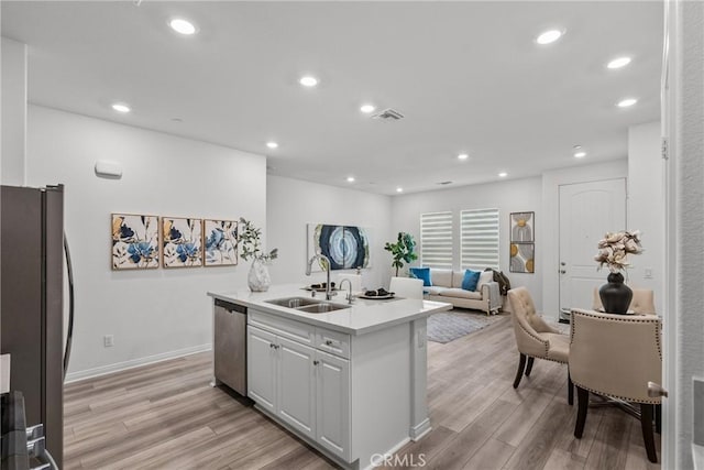 3981 E Huntington St, Ontario, CA 91761 - kitchen with a sink, light wood-style floors, light countertops, and appliances with stainless steel finishes