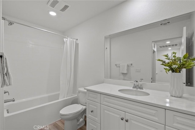3981 E Huntington St, Ontario, CA 91761 - bathroom featuring toilet, vanity, visible vents, and wood finished floors