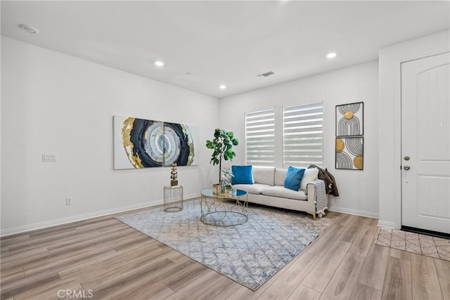 3981 E Huntington St, Ontario, CA 91761 - living area with visible vents, wood finished floors, baseboards, and recessed lighting
